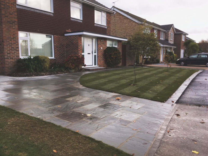 Kandla Grey Indian Sandstone Paving used in a garden path