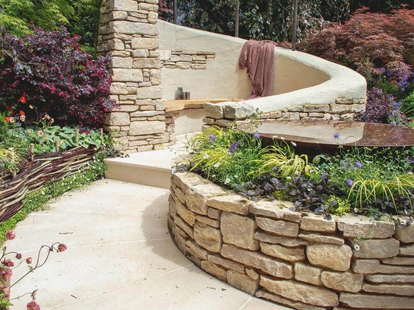 BUILDING A NATURAL STONE RETAINING WALL WITH PURBECK RANDOM WALLING STONE