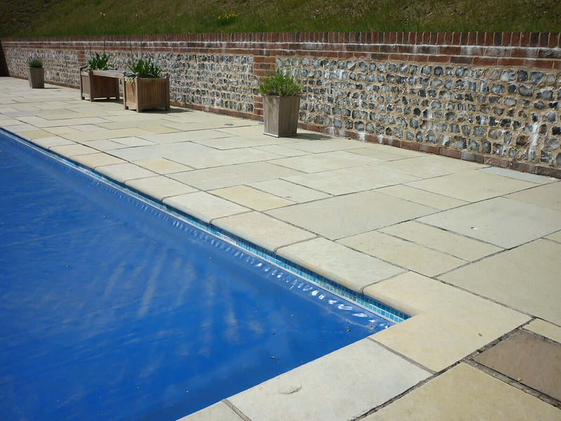 Amber limestone surrounding a home swimming pool