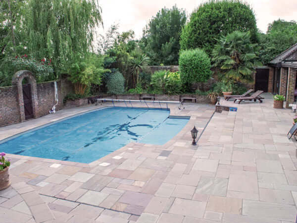 Bronte Indian Sandstone Paving near a swimming pool