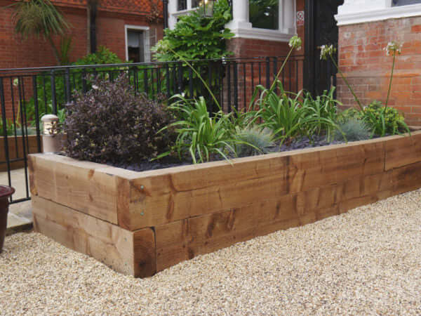 New Softwood Sleepers Used As A Raised Flower Bed in Dorset